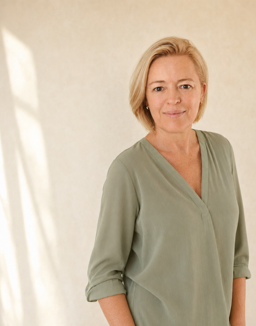 Gizella Ward standing in a sage blouse